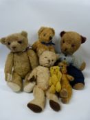 Six blonde teddy bears including a Steiff miniature example, some with growlers,