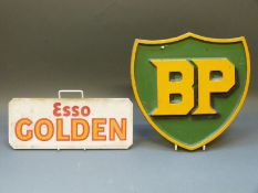 Aluminium BP sign and an 'Esso Golden' petrol pump glass panel
