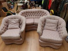 A pink ground three piece suite with serpentine front,