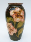 Moorcroft vase in Hibiscus pattern by Walter Moorcroft with light flambe glaze (18cm tall)