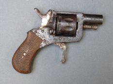 A nine shot hammer action blank firing revolver with chequered grips, folding trigger and 1.