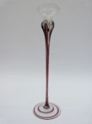 An Art Nouveau solifleur vase or candle holder of elongated form,