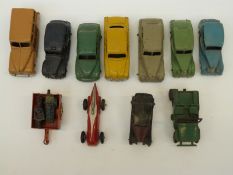 Fourteen Dinky Toys diecast model vehicles including racing car, taxi,