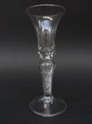 A 19thC air twist drinking glass with knopped stem and conical foot,