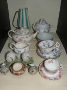 A 19th century lidded sucrier, tea cups and saucers, Royal Doulton tea cup and saucer,