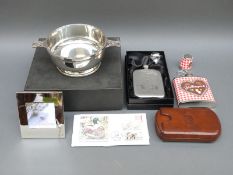 A collection of shooting related items including hip flasks, photo frame,