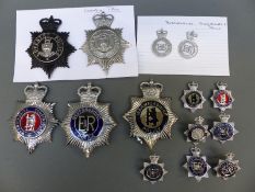 A collection of police badges including Bedfordshire,