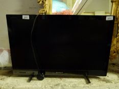 A Sony flatscreen television and accessories
