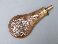 Copper and brass powder flask made for the Australian market with embossed decoration of a kangaroo,