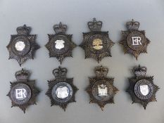 Eight police helmet badges including Durham, Gloucestershire Constabulary,
