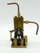 A vertical compact live steam marine engine with solid flywheel