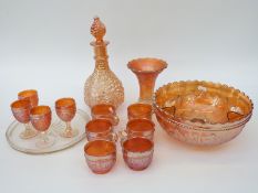 A collection of Carnival glass including a punch bowl