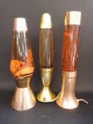 Three c1960's lava lamps, two with copper ends,