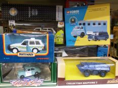 Approximately 35 boxed model police vehicles including Corgi and Matchbox