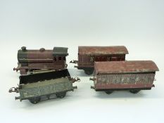 Hornby 0 gauge 0-4-0 locomotive 5600 and three carriages