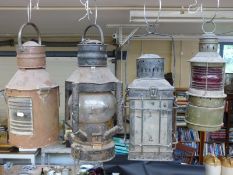 Four various ships' lamps