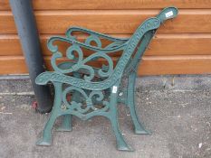 A pair of cast iron garden bench ends