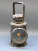 A tri colour railway hand lamp