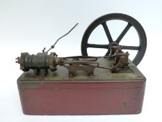 A late 19th/early 20thC horizontal live steam stationary steam engine mounted on wooden base with