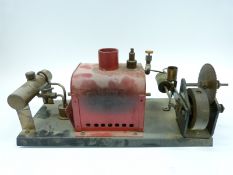 A steam plant comprising a horizontal copper boiler connected to a Bowman Models 101 steam engine
