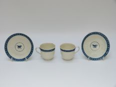 A pair of first period Worcester tea cups and saucers with open crescent marks