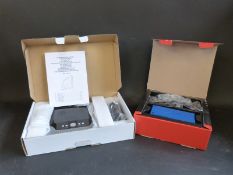 An in-car DVD player and a bluetooth in-car system Parrot CK3100 LCD, both new,