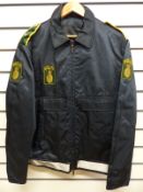 A Norwegian Politi police officer's tunic and trousers together with a blue bomber jacket