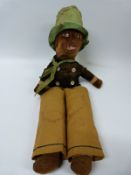 A 19thC straw filled doll with felt body and original clothing, 54cm tall.