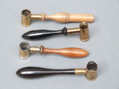 Four brass and white metal shot/powder measures by James Dixon & Sons and similar,