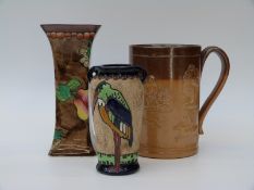 A Doulton Lambeth strap handle mug together with a Coronaware 