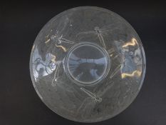 A frosted glass dish decorated with a dragonfly,