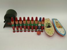 A quantity of vintage toys to include two clockwork boats,