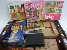 Over twenty various children's puzzles and games including student's microscope, Subbuteo etc.