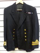 A Gieves naval jacket and trousers named E C Singleton RN and dated 1965 inside jacket