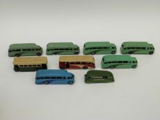 Nine Dinky Toys diecast model single deck buses, five in mint green, one in pale blue,