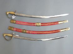 Two decorative Indian swords with scabbards,