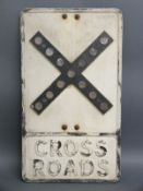 A vintage cast aluminium 'crossroads' road sign with honeycomb style reflectors,