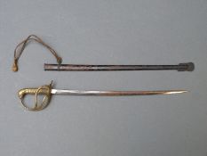 A miniature cavalry sword in sheath, possibly a letter opener,