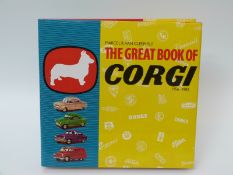 The Great Book of Corgi 1956-1983 by Marcel R Van Cleemput together with red pocket book
