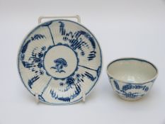 A first period Worcester tea bowl and saucer with open crescent mark to base