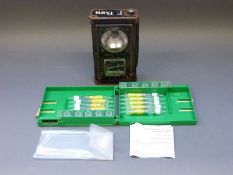 A Guardian traffic lamp and a small case of breath testing equipment.