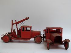 Two Tri-ang pressed steel lorries, both in red,