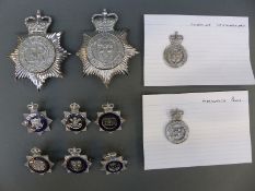 A collection of various police badges including Merseyside, Cheshire,