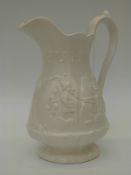 A decorative ceramic jug with a Punch and Judy show decoration (26cm tall)