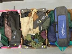 A collection of rod holdalls and rod bags,