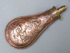 Copper and brass powder flask with embossed decoration of dogs,