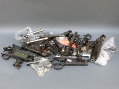 A large collection of rifle bolts.