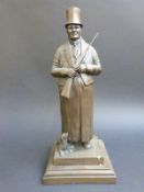 A bronzed figure holding a gun 'The Bishop of Bond St 1815-1871' by David Hughes,