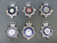 Six enamel police helmet badges including Northamptonshire, Suffolk, West Midland,