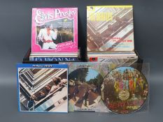 Two cases of LPs including two Beatles picture discs Sgt Pepper and Abbery Road,